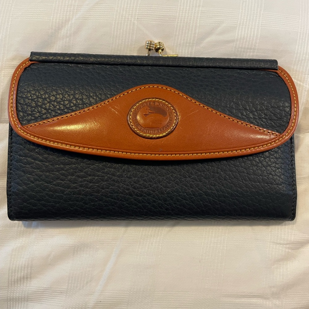 Dooney and Bourke vintage wallet. 7 1/4” wide. Beautiful condition.